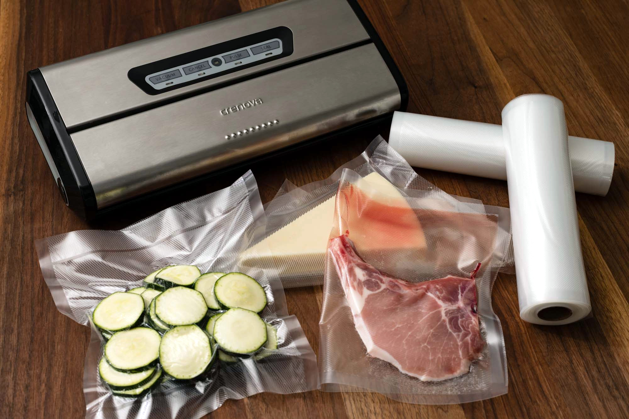 A vacuum sealer machine with food sealed in a bag on a wooden board